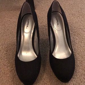 Black suede pumps